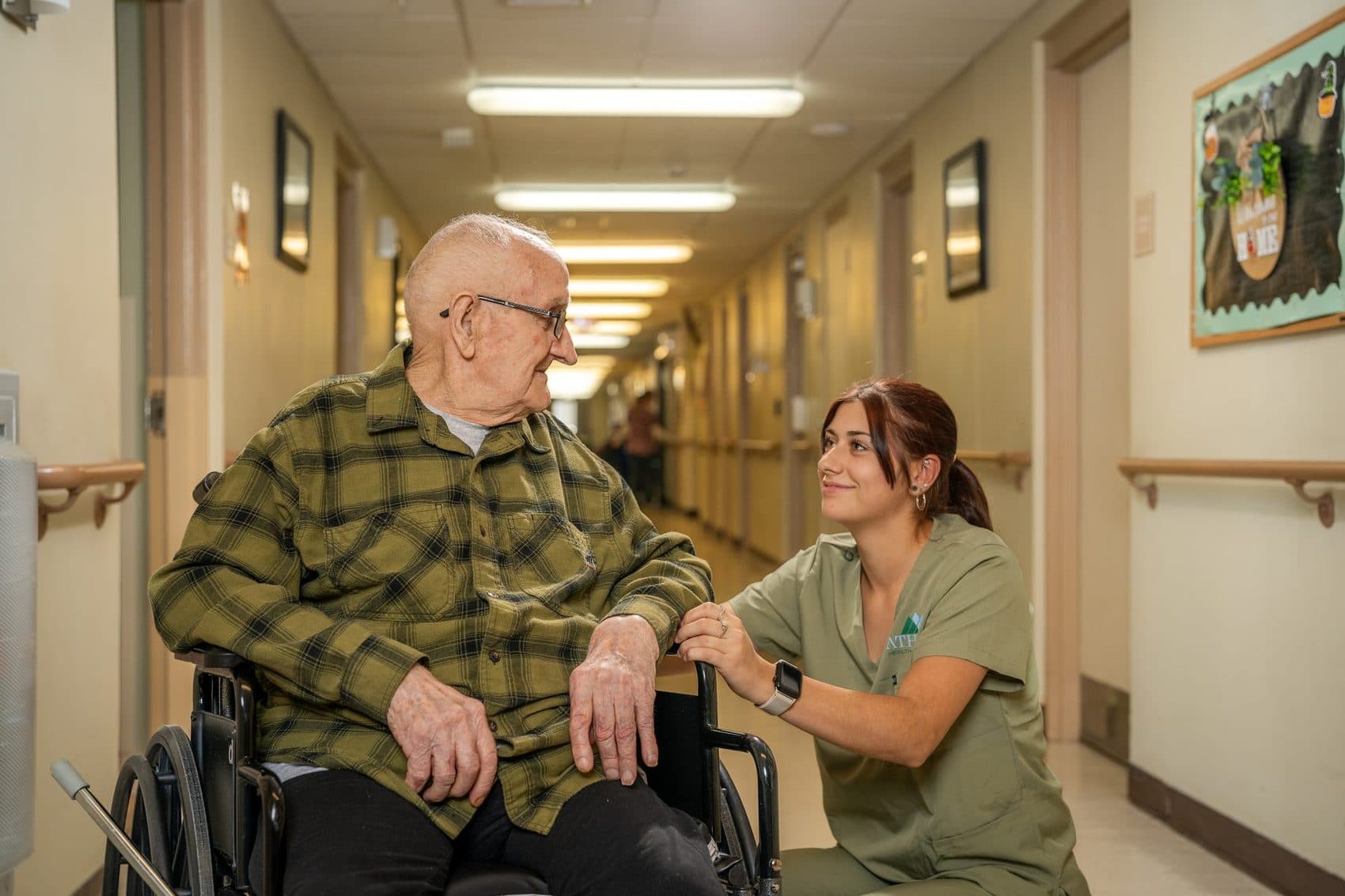 Caregiver with resident at a senior care facility