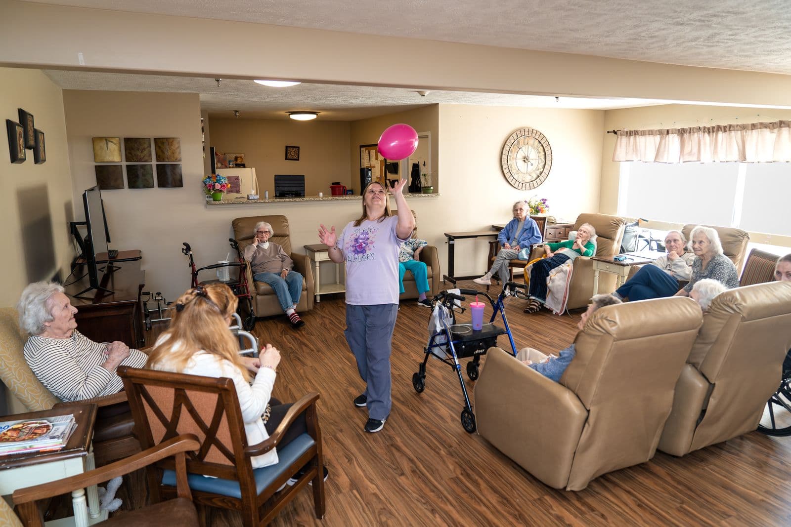 Residents enjoying a balloon activity